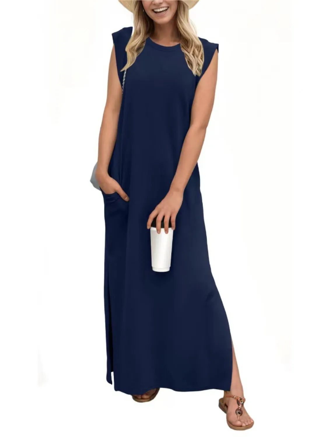 Woman wearing a navy blue sleeveless dress on a white background